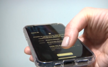 A hand holding a smartphone